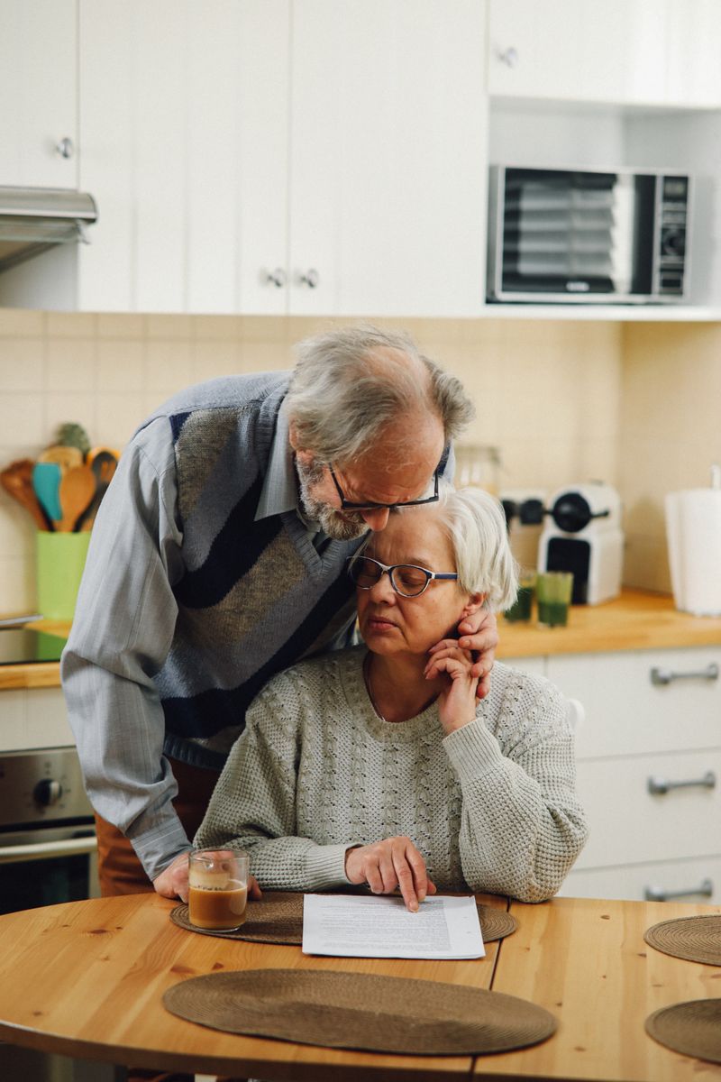 Elderly couple sharing a touching, loving moment in a cozy kitchen